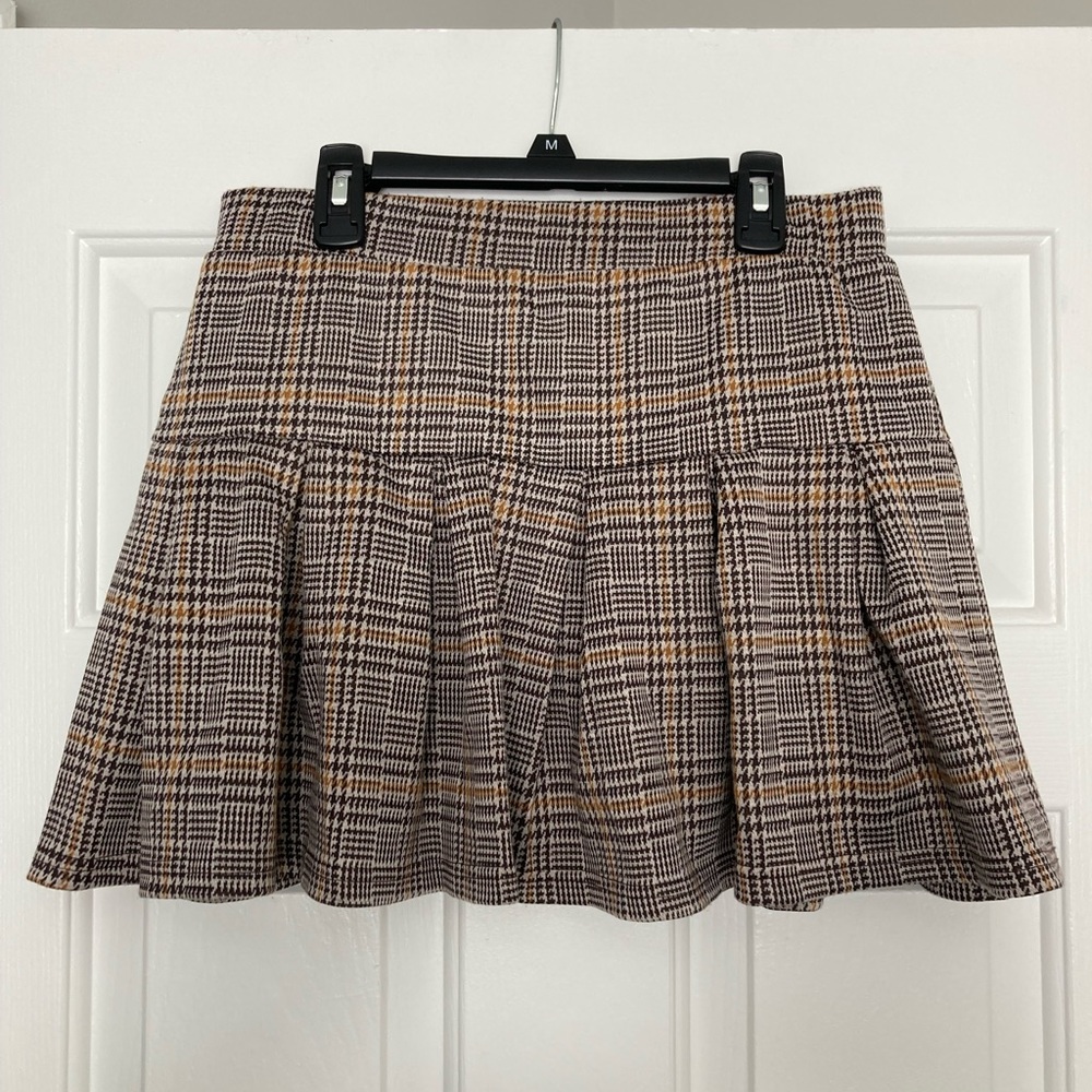 Large plaid skirt.
